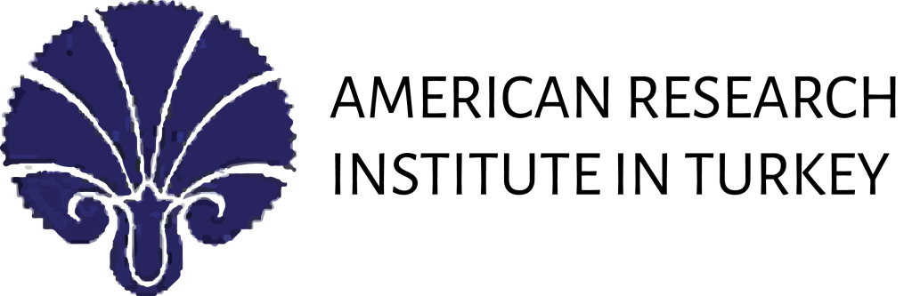 A blue and white logo with a flower on it.